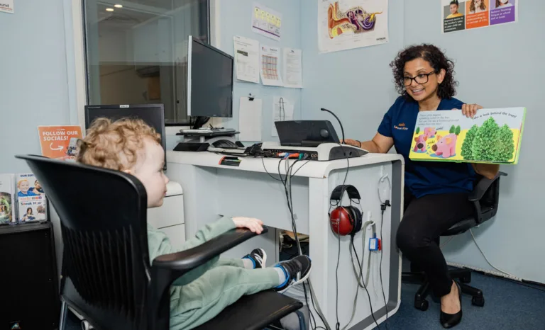 A child undergoing a hearing test with headphones at South Australia Speech and Hearing Centre
