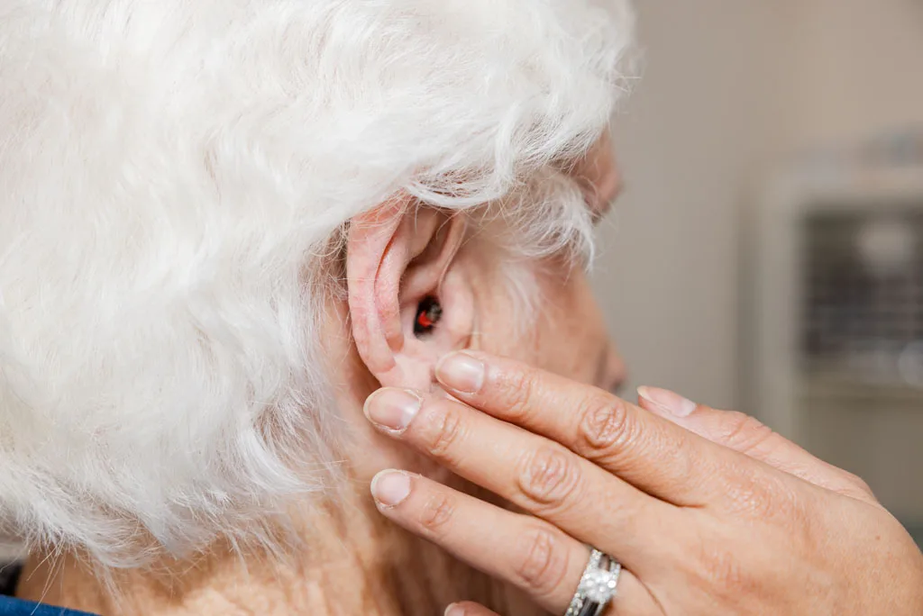 Compact digital hearing aids in a protective case