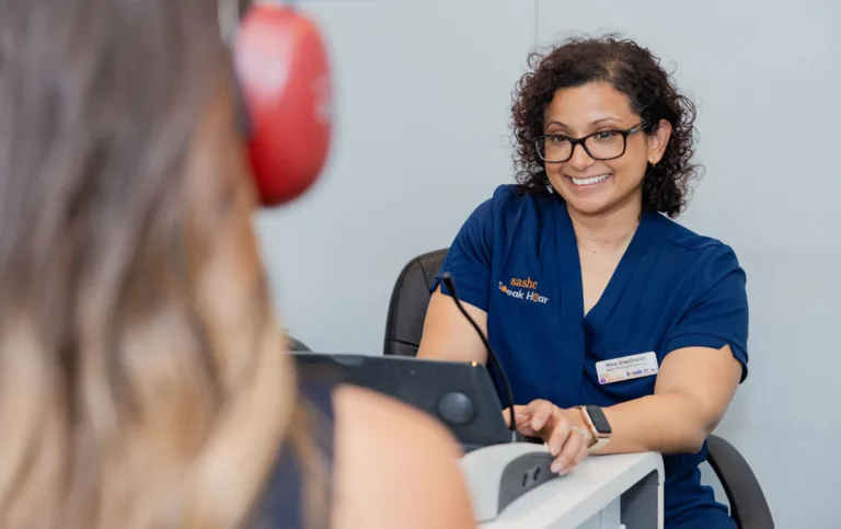 A patient consulting with an audiologist at South Australia Speech and Hearing Centre