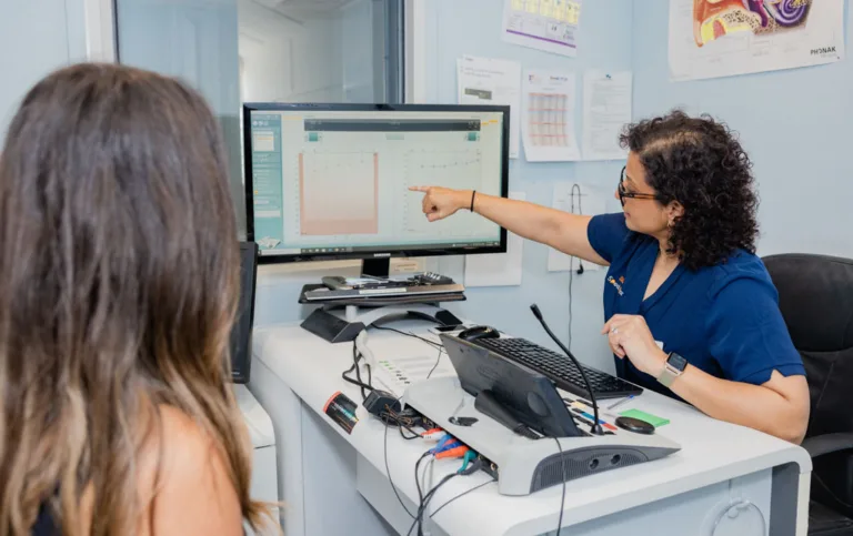 An audiologist explaining the results of a hearing test to her patient at South Australia Speech and Hearing Centre