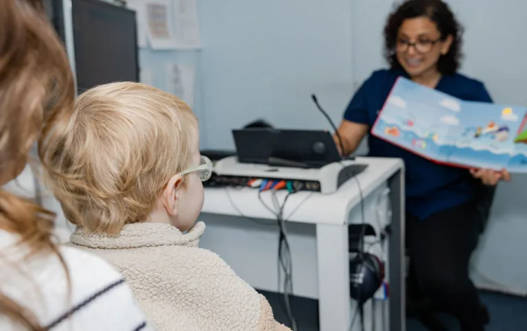 A child undergoing an audiology test with headphones at South Australia Speech and Hearing Centre
